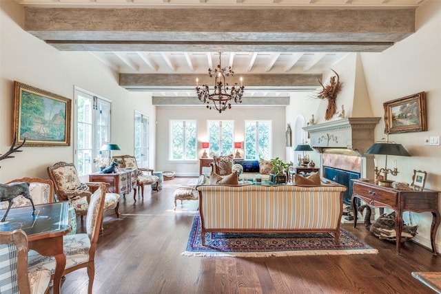 4107 Turtle Creek Blvd, Dallas, TX 75219 - living area featuring a chandelier, wood finished floors, beamed ceiling, and a tiled fireplace
