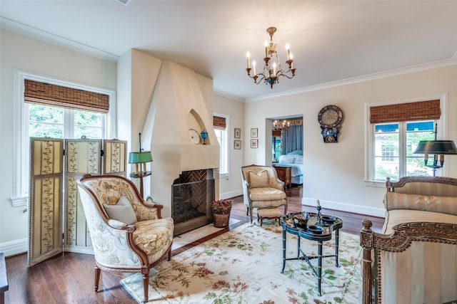4107 Turtle Creek Blvd, Dallas, TX 75219 - living area featuring a chandelier, wood finished floors, crown molding, baseboards, and a fireplace