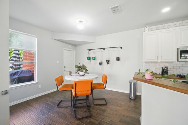 10014 Fairway Vista Dr, Rowlett, TX 75089 - dining room featuring dark wood-style flooring and baseboards