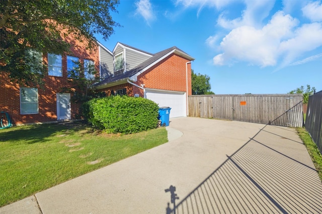 10014 Fairway Vista Dr, Rowlett, TX 75089 - view of side of home with brick siding, driveway, and an attached garage