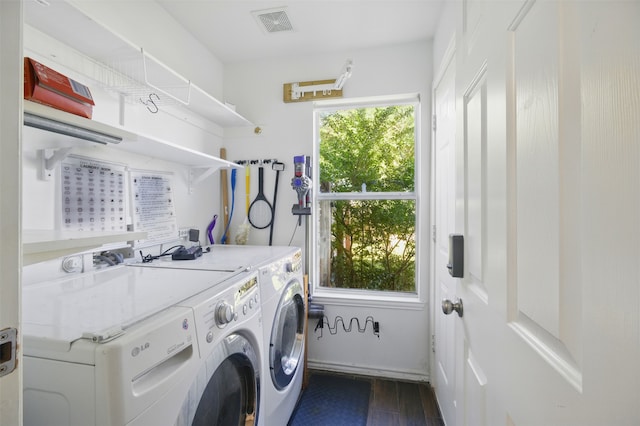 10014 Fairway Vista Dr, Rowlett, TX 75089 - laundry room featuring washing machine and clothes dryer and dark wood-style floors