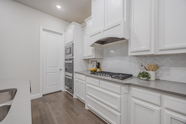 14844 Gentry Dr, Aledo, TX 76008 - kitchen featuring stainless steel appliances, tasteful backsplash, white cabinets, dark wood finished floors, and recessed lighting
