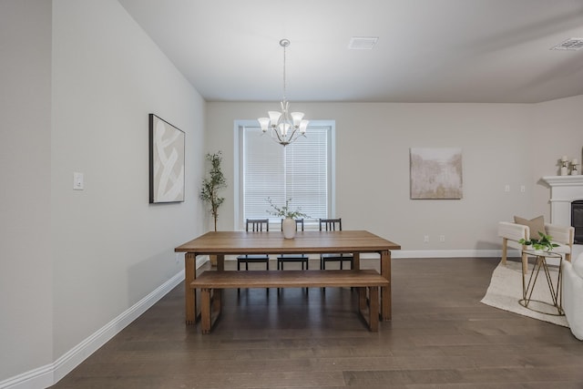 14844 Gentry Dr, Aledo, TX 76008 - dining space with a chandelier, dark wood-style flooring, baseboards, and a fireplace