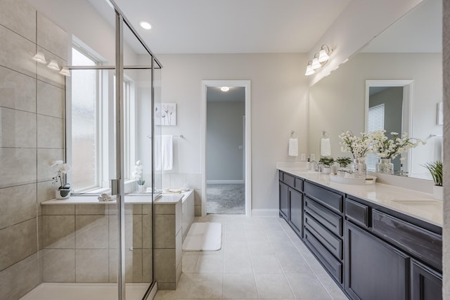 14844 Gentry Dr, Aledo, TX 76008 - bathroom with double vanity, a bath, a stall shower, tile patterned floors, and baseboards