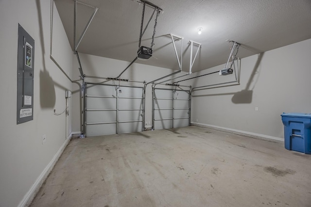 14844 Gentry Dr, Aledo, TX 76008 - garage with a garage door opener, electric panel, and baseboards