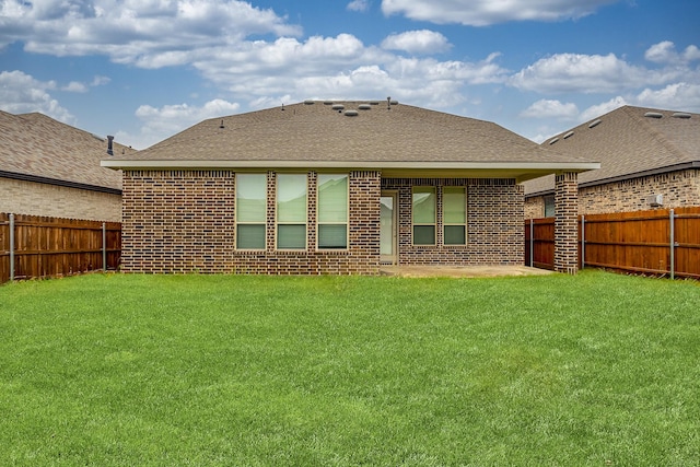 14844 Gentry Dr, Aledo, TX 76008 - back of property with brick siding, roof with shingles, and a patio