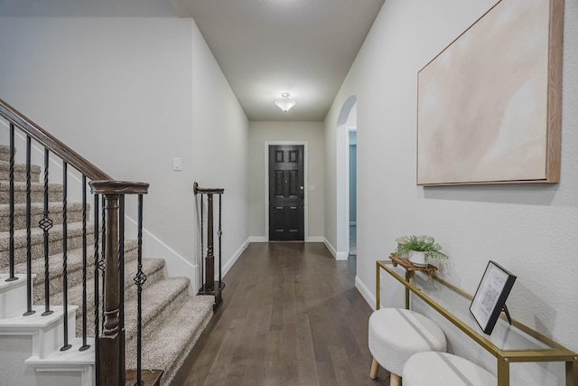 14844 Gentry Dr, Aledo, TX 76008 - entrance foyer with arched walkways, dark wood-style floors, stairs, and baseboards