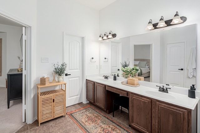 3159 Market Center Dr, Rockwall, TX 75032 - ensuite bathroom featuring double vanity, a towering ceiling, and tile patterned floors