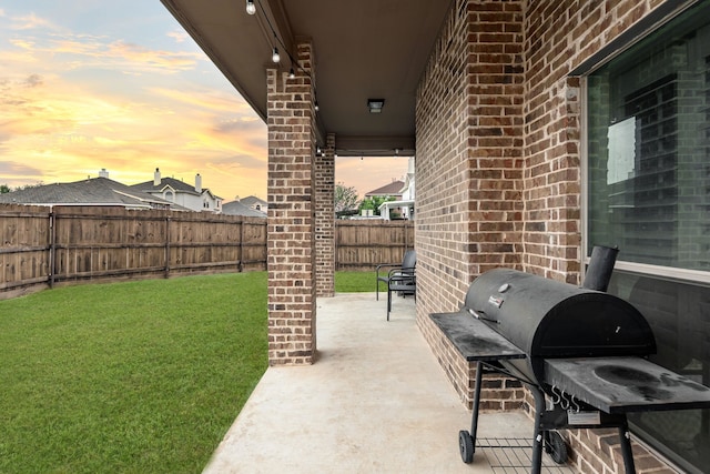 3159 Market Center Dr, Rockwall, TX 75032 - patio terrace at dusk featuring a patio and grilling area