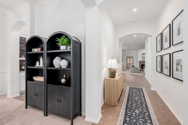 3159 Market Center Dr, Rockwall, TX 75032 - corridor featuring crown molding, arched walkways, recessed lighting, built in shelves, and light carpet