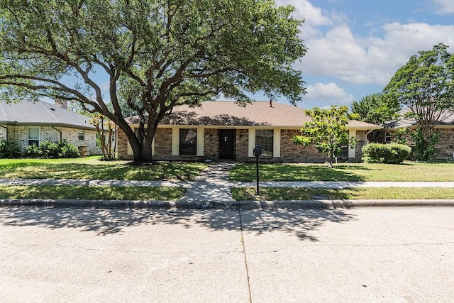 1720 Hearthstone Dr, Plano, TX 75023 - view of front of property featuring brick siding and a front yard