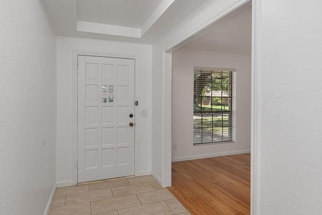 1720 Hearthstone Dr, Plano, TX 75023 - foyer entrance featuring light tile patterned flooring, baseboards, and crown molding
