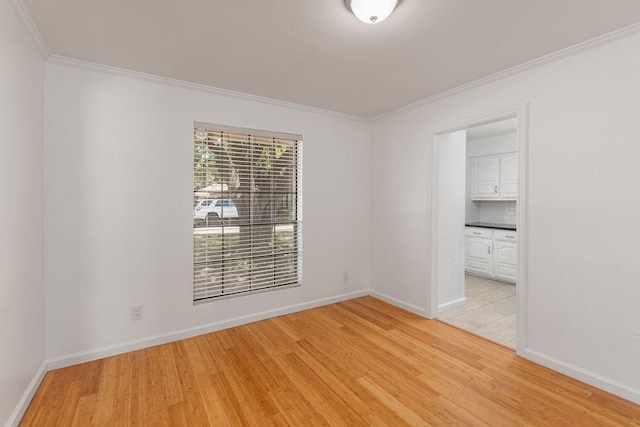 1720 Hearthstone Dr, Plano, TX 75023 - unfurnished room featuring crown molding, light wood finished floors, and baseboards
