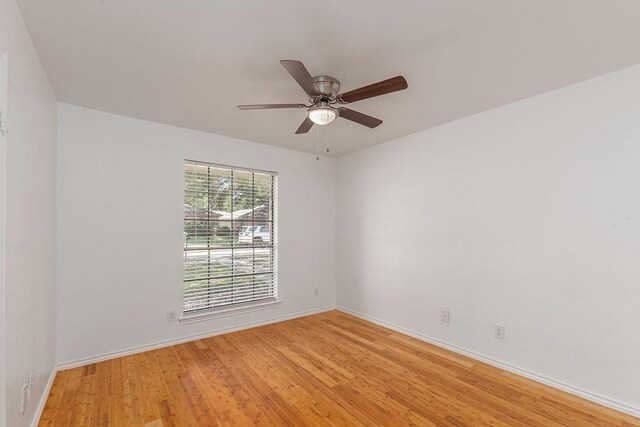 1720 Hearthstone Dr, Plano, TX 75023 - spare room featuring light wood-style floors, baseboards, and a ceiling fan