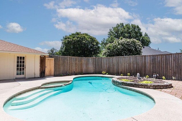 1720 Hearthstone Dr, Plano, TX 75023 - view of swimming pool featuring a fenced backyard, a pool with connected hot tub, and a patio area