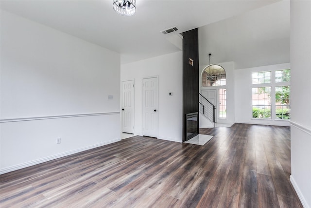 3713 Dentelle Dr, Plano, TX 75023 - unfurnished living room featuring wood finished floors, baseboards, and a high ceiling