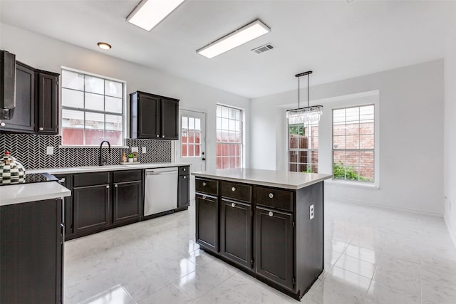 3713 Dentelle Dr, Plano, TX 75023 - kitchen with stainless steel dishwasher, a sink, plenty of natural light, and light countertops