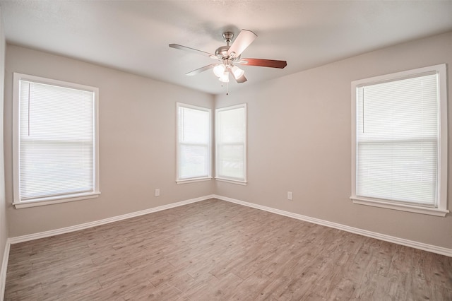 6917 Richlynn Ter, Richland Hills, TX 76118 - spare room with light wood-style flooring, a ceiling fan, and baseboards