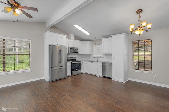 7008 Soda Point Dr, Shreveport, LA 71107 - kitchen featuring appliances with stainless steel finishes, a sink, a chandelier, white cabinetry, and baseboards