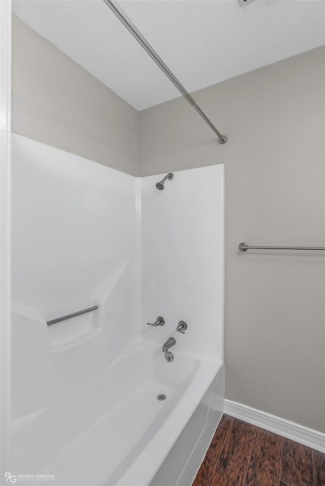 7008 Soda Point Dr, Shreveport, LA 71107 - full bath featuring shower / bath combination, wood finished floors, and baseboards