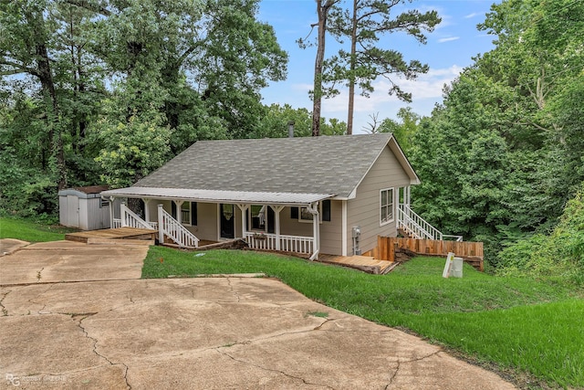 7008 Soda Point Dr, Shreveport, LA 71107 - view of front of home featuring covered porch, roof with shingles, driveway, and a front yard