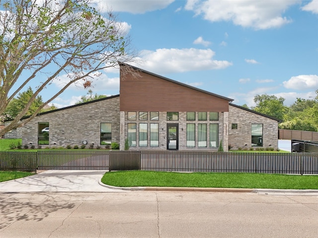 11110 Saint Michaels Dr, Dallas, TX 75230 - view of building exterior with concrete driveway and a fenced front yard