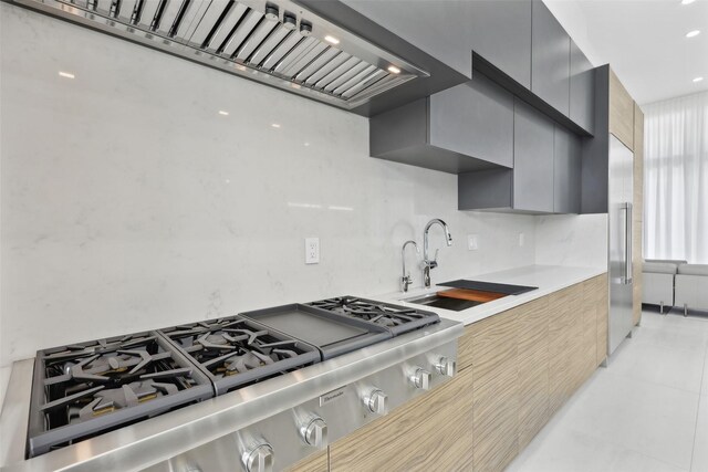 11110 Saint Michaels Dr, Dallas, TX 75230 - kitchen featuring premium range hood, appliances with stainless steel finishes, modern cabinets, light countertops, and a sink