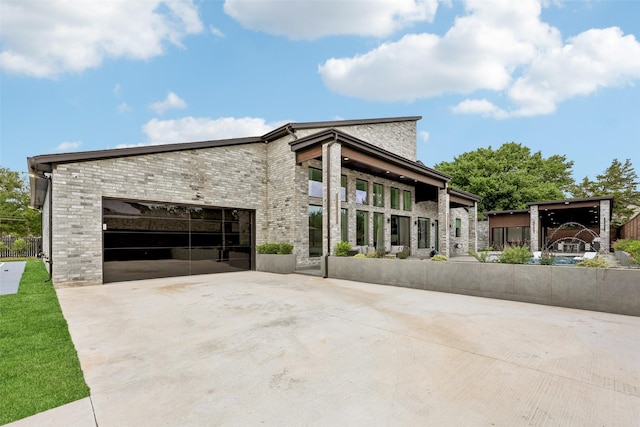 11110 Saint Michaels Dr, Dallas, TX 75230 - view of side of property featuring concrete driveway, an attached garage, and brick siding