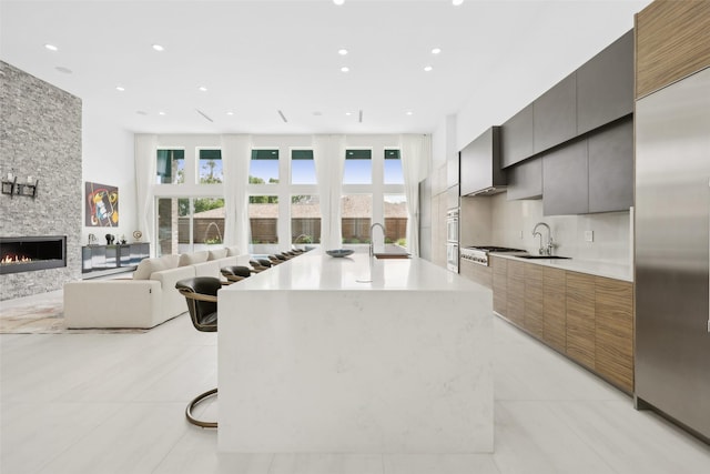 11110 Saint Michaels Dr, Dallas, TX 75230 - kitchen with modern cabinets, built in fridge, plenty of natural light, and recessed lighting