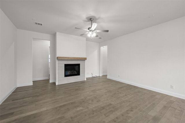 1021 Allegheny Ct, Burleson, TX 76028 - unfurnished living room with ceiling fan, wood finished floors, a fireplace, and baseboards