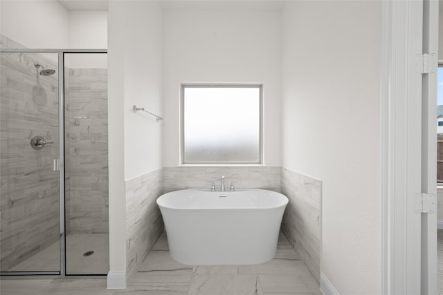 1021 Allegheny Ct, Burleson, TX 76028 - full bath featuring a shower stall, a soaking tub, wainscoting, and marble finish flooring