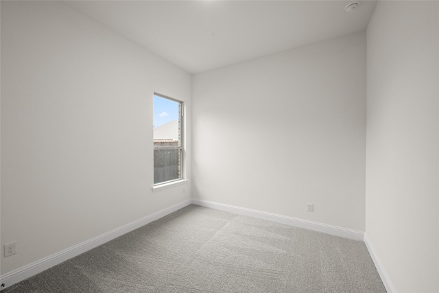 1021 Allegheny Ct, Burleson, TX 76028 - empty room featuring carpet, baseboards, and a smoke detector