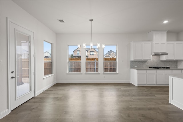 1021 Allegheny Ct, Burleson, TX 76028 - unfurnished dining area featuring dark wood-type flooring, baseboards, and recessed lighting