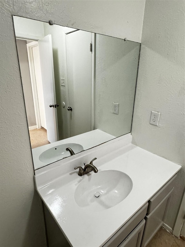 5412 Brookhollow Dr, Sachse, TX 75048 - bathroom featuring vanity and a textured wall