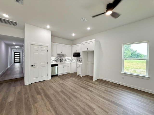 1315 Oneal St, Commerce, TX 75428 - kitchen with appliances with stainless steel finishes, wood finished floors, ceiling fan, and recessed lighting