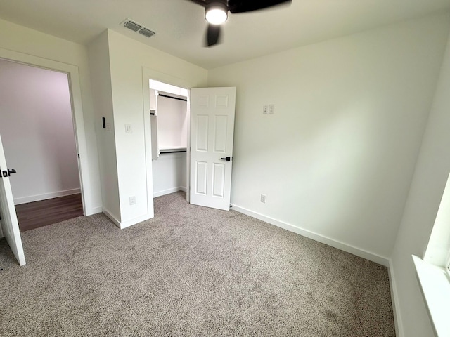 1315 Oneal St, Commerce, TX 75428 - unfurnished bedroom with carpet flooring, baseboards, a closet, and a ceiling fan