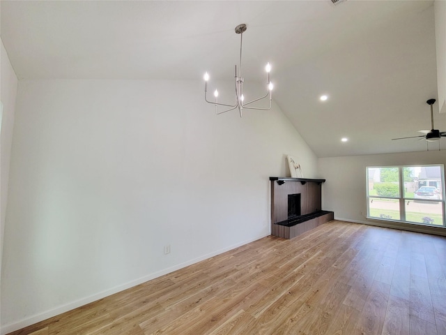 2317 Woodhollow Ave, Mesquite, TX 75150 - unfurnished living room featuring a chandelier, light wood-style flooring, a tile fireplace, high vaulted ceiling, and baseboards