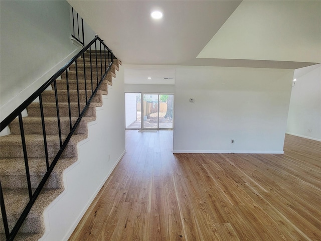 2317 Woodhollow Ave, Mesquite, TX 75150 - unfurnished living room with wood finished floors, stairway, baseboards, and recessed lighting
