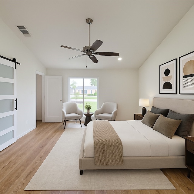 2317 Woodhollow Ave, Mesquite, TX 75150 - bedroom featuring vaulted ceiling, light wood-style flooring, a barn door, recessed lighting, and a ceiling fan