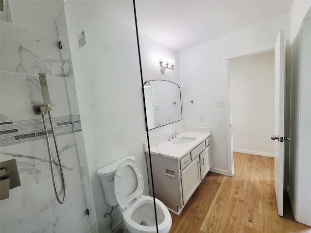 2317 Woodhollow Ave, Mesquite, TX 75150 - full bath with vanity, a marble finish shower, wood finished floors, toilet, and baseboards
