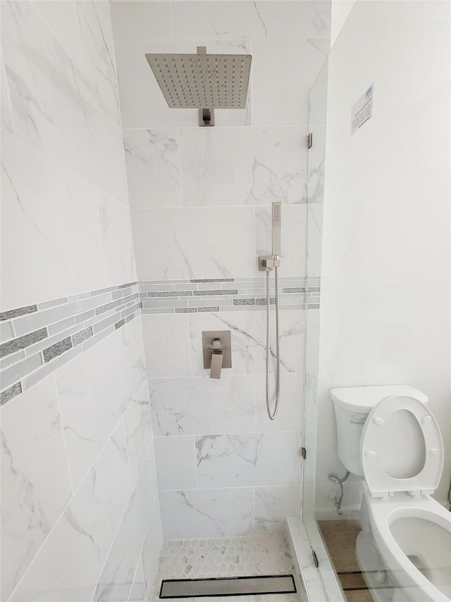 2317 Woodhollow Ave, Mesquite, TX 75150 - bathroom featuring toilet and tiled shower