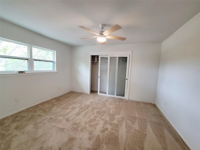 2317 Woodhollow Ave, Mesquite, TX 75150 - unfurnished bedroom with carpet flooring, a closet, and a ceiling fan