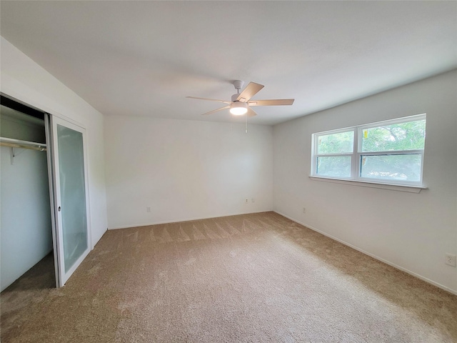 2317 Woodhollow Ave, Mesquite, TX 75150 - unfurnished bedroom with carpet flooring, a closet, a ceiling fan, and baseboards