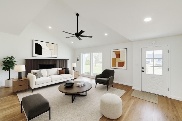 2317 Woodhollow Ave, Mesquite, TX 75150 - living room featuring light wood-type flooring, ceiling fan, lofted ceiling, recessed lighting, and baseboards