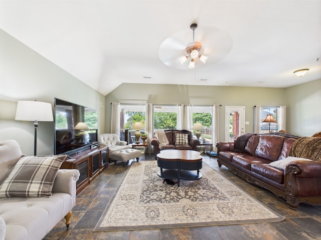 1409 Stoney Hills Dr, Cedar Hill, TX 75104 - living area featuring stone tile floors, ceiling fan, and lofted ceiling
