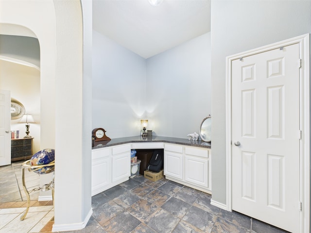 1409 Stoney Hills Dr, Cedar Hill, TX 75104 - bathroom with baseboards, vanity, and stone finish flooring