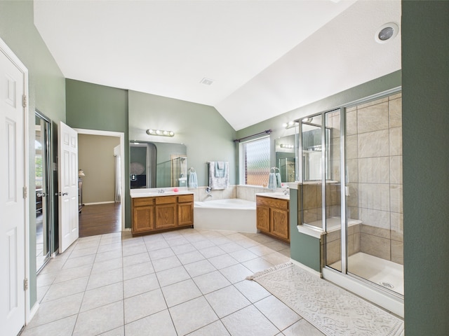 1409 Stoney Hills Dr, Cedar Hill, TX 75104 - full bath featuring tile patterned flooring, vanity, a bath, lofted ceiling, and a shower stall