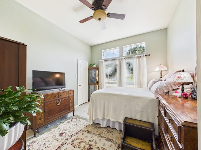 1409 Stoney Hills Dr, Cedar Hill, TX 75104 - bedroom with light tile patterned floors, ceiling fan, and lofted ceiling