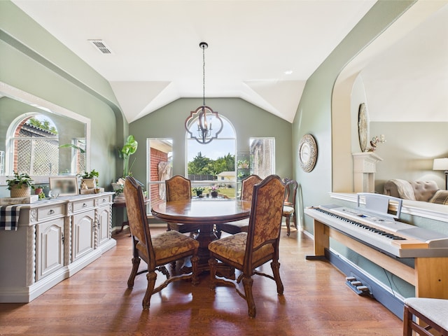 1409 Stoney Hills Dr, Cedar Hill, TX 75104 - dining room with a chandelier, wood finished floors, lofted ceiling, and baseboards