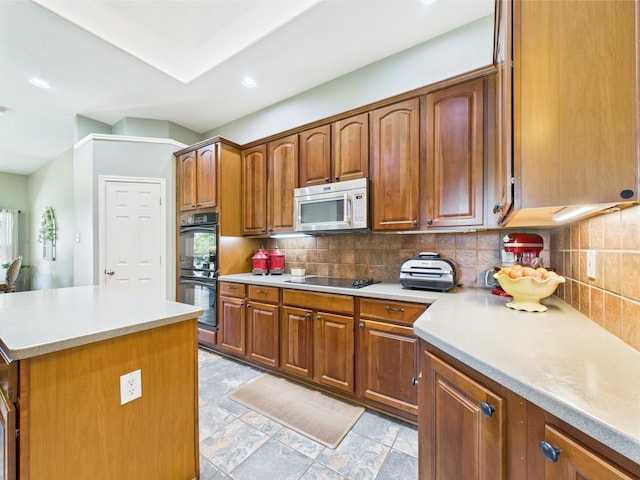 1409 Stoney Hills Dr, Cedar Hill, TX 75104 - kitchen featuring black appliances, backsplash, light countertops, brown cabinetry, and recessed lighting